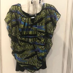 Black sleeveless under flowing print crepe poncho